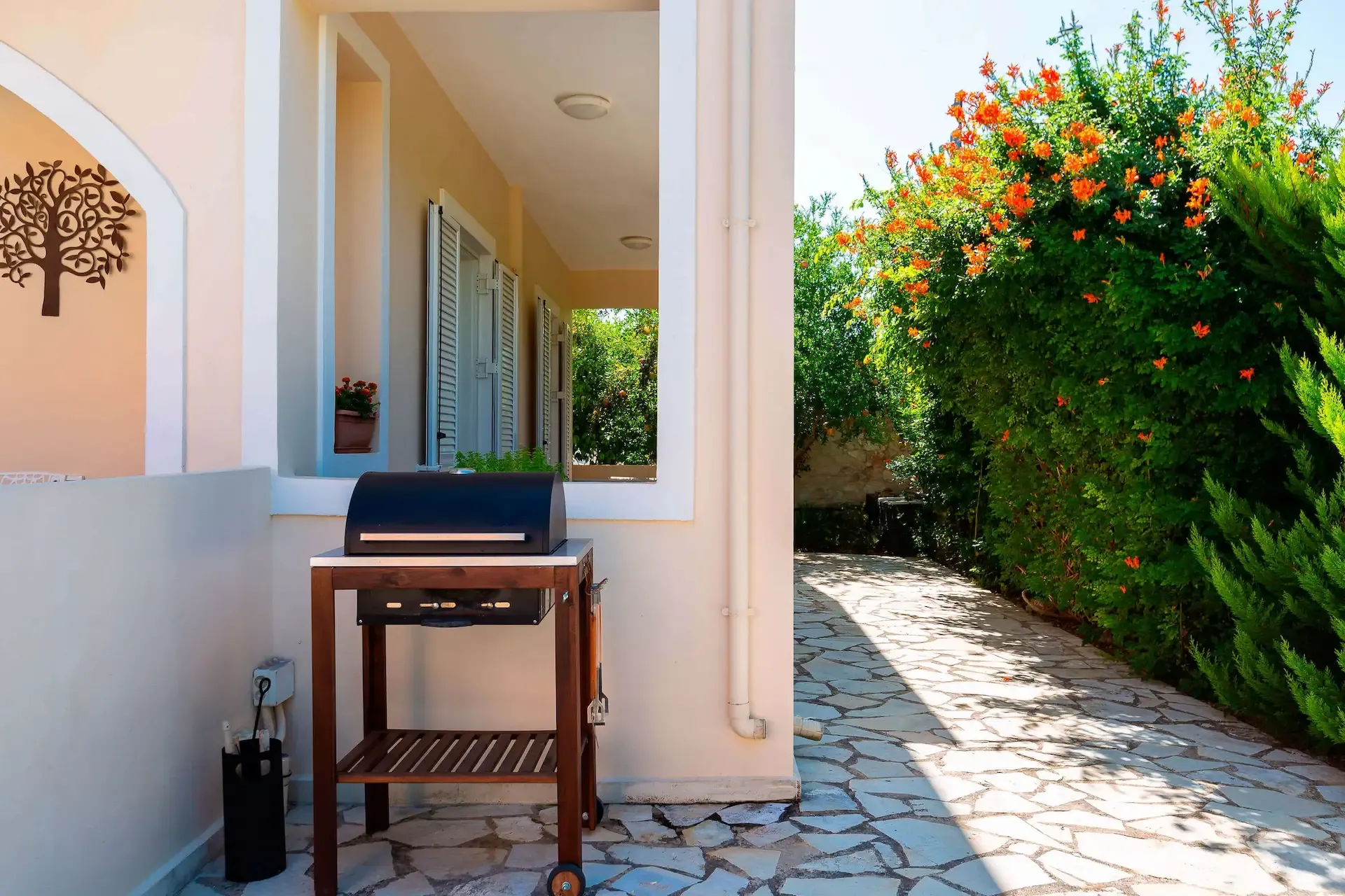 Outdoor dining area with BBQ grill